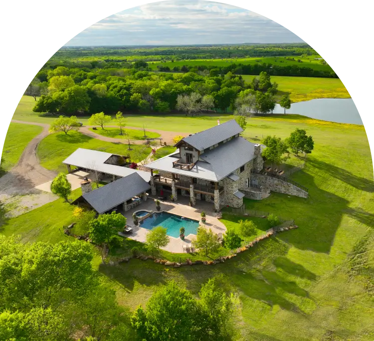 A large house with a pool in the middle of it